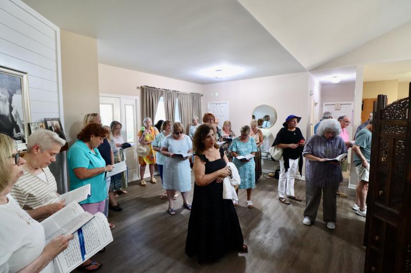 Women celebrating the Shabbat before the event moved outside.